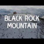 scrambling-black-rock-mountain-in-winter