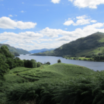 View of a lake and hills with blue cloudy sky on The West Highland Way