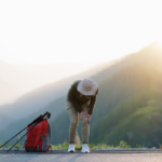 hiking women bending over touching injured knee