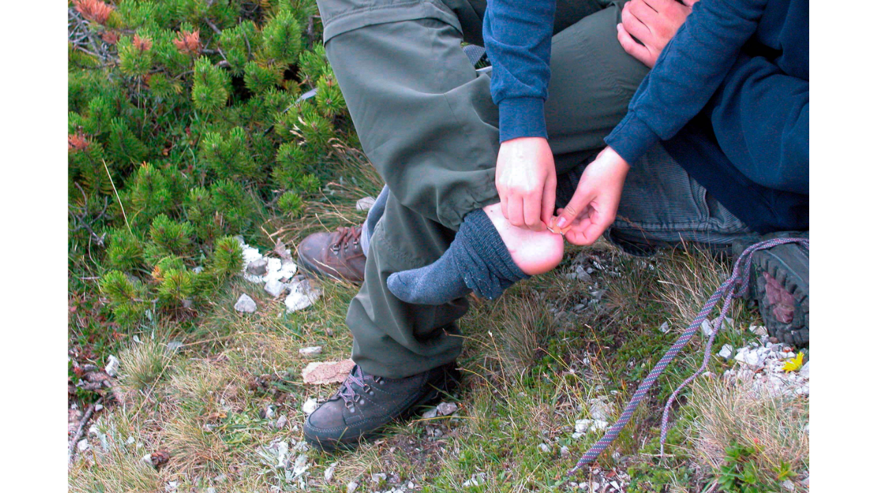 Putting a plaster over a Blister from wearing hiking boots